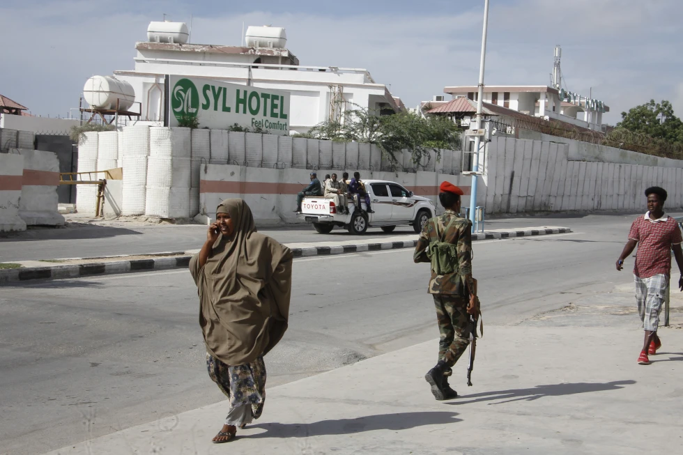 Loud explosion is heard as Somali militant group says its fighters have attacked a hotel in capital